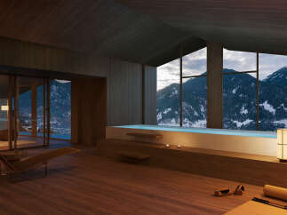 Mountain view luxury spa with indoor pool and chaise lounge.