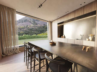 Modern kitchen with stunning mountain views.