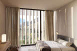 Wake up to breathtaking mountain views from this serene bedroom.
