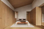 This stunning bedroom boasts a minimalist design with built-in wooden wardrobes, creating ample storage space.