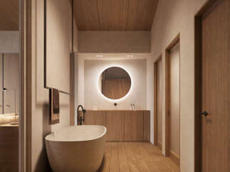 This stunning bathroom boasts a minimalist design with a freestanding bathtub, sleek wooden cabinetry, and a large circular mirror.