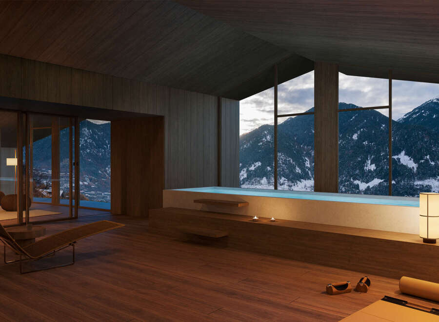 Mountain view luxury spa with indoor pool and chaise lounge.