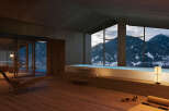 Mountain view luxury spa with indoor pool and chaise lounge.