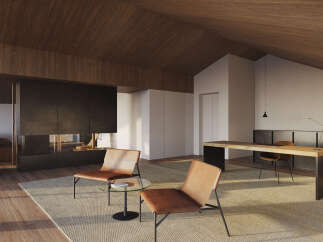 Modern living space with a sleek fireplace and comfortable leather armchairs.