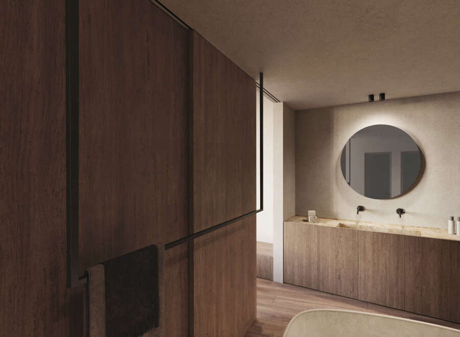 Luxurious bathroom with wooden wall paneling and a sleek, round mirror.