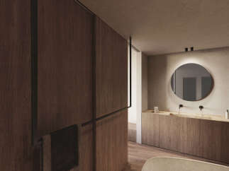 Luxurious bathroom with wooden wall paneling and a sleek, round mirror.