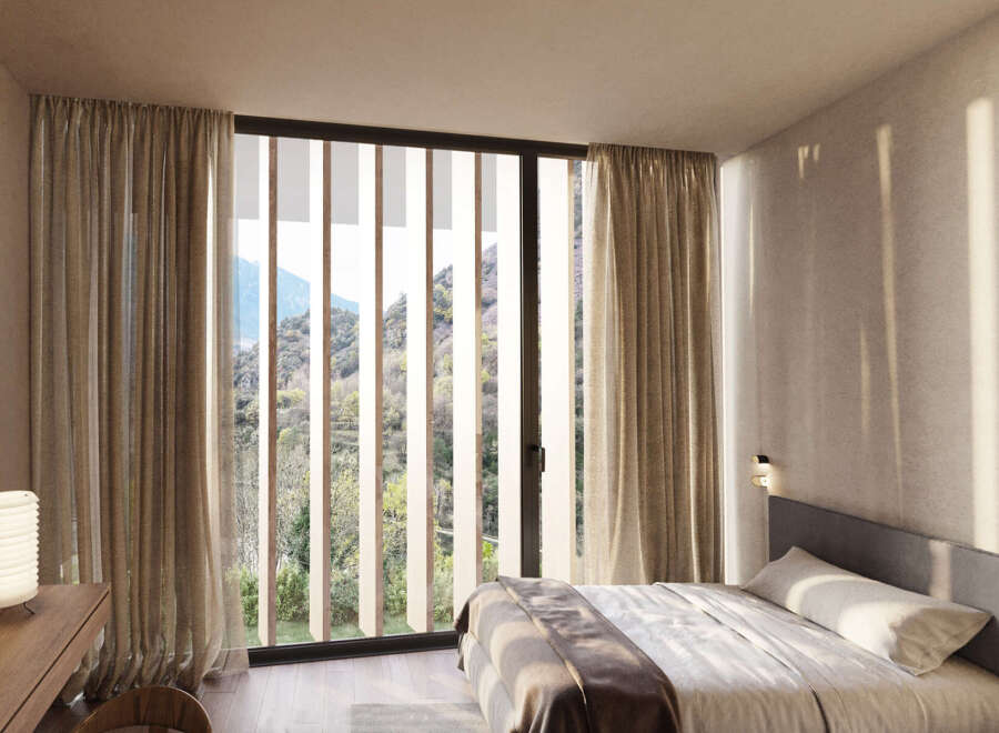 Wake up to breathtaking mountain views from this serene bedroom.