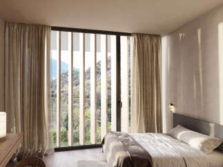 Wake up to breathtaking mountain views from this serene bedroom.