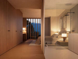 Luxurious bedroom with ensuite bathroom and mountain views.