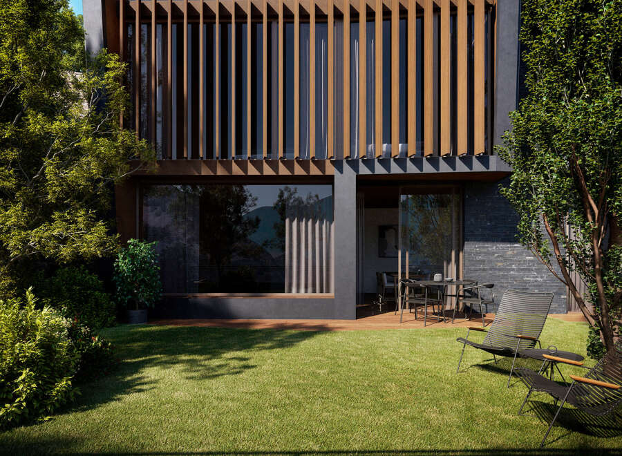 Modern house with a sleek design and large windows, showcasing a beautiful garden with lush green grass and stylish outdoor furniture.