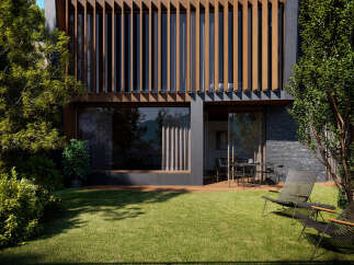 Modern house with a sleek design and large windows, showcasing a beautiful garden with lush green grass and stylish outdoor furniture.