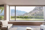 Stunning mountain views from this luxurious home's expansive window wall.
