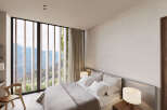 Wake up to breathtaking mountain views from this luxurious bedroom.
