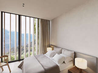 Wake up to breathtaking mountain views from this luxurious bedroom.