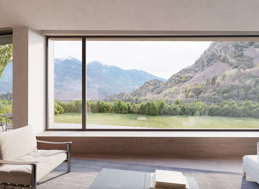 Stunning mountain views from this luxurious home's expansive window wall.
