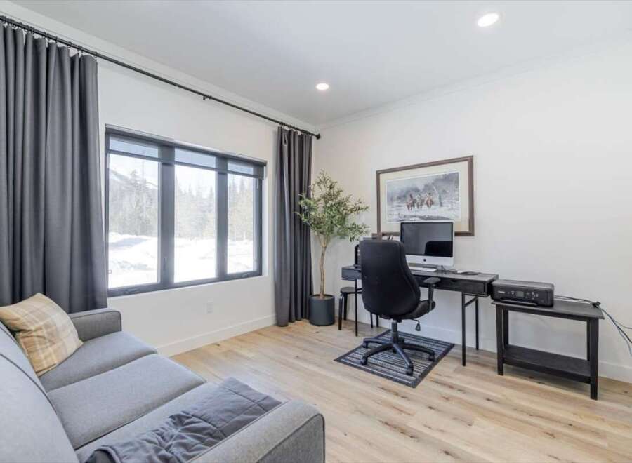 Discover the perfect blend of comfort and functionality in this stunning home office.