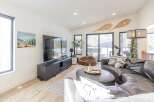 Step into luxury with this stunning living space, featuring a sleek, modern design.