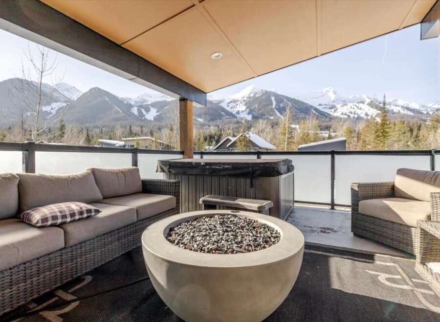Enjoy breathtaking mountain views from this luxurious outdoor patio.