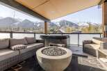 Enjoy breathtaking mountain views from this luxurious outdoor patio.