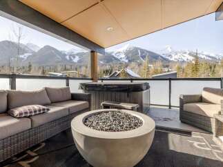 Enjoy breathtaking mountain views from this luxurious outdoor patio.