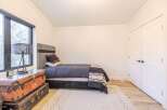 Discover a cozy bedroom retreat! This space features a stylish bed, perfect for relaxation.