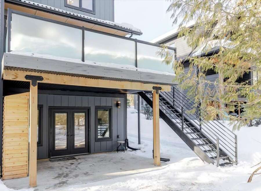 Discover modern living with this stunning property featuring a sleek glass-railed balcony.