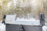 Enjoy a relaxing soak in the hot tub surrounded by a winter wonderland.