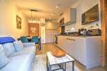 This stunning apartment boasts a modern open-plan kitchen and living area, perfect for entertaining.