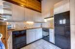 Discover a charming kitchen with a modern touch.