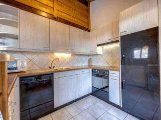 Discover a charming kitchen with a modern touch.