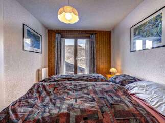 Cozy bedroom with a mountain view.