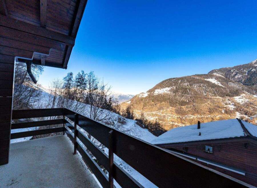 Enjoy breathtaking mountain views from this cozy chalet.