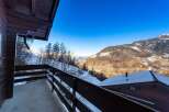 Enjoy breathtaking mountain views from this cozy chalet.