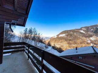 Enjoy breathtaking mountain views from this cozy chalet.