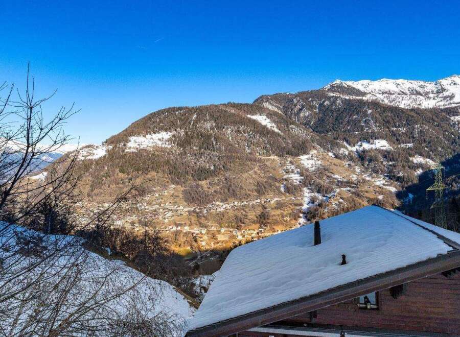 Experience the charm of a snow-covered chalet nestled in the heart of the mountains.