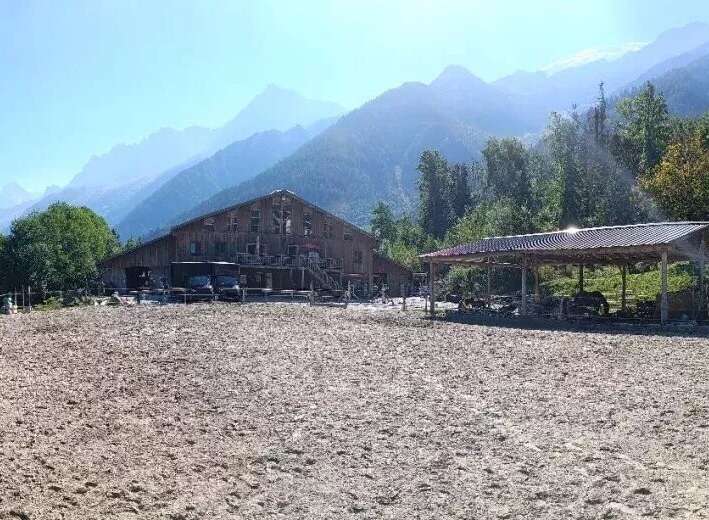 Discover a stunning equestrian property nestled in a picturesque mountain setting.