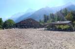 Discover a stunning equestrian property nestled in a picturesque mountain setting.