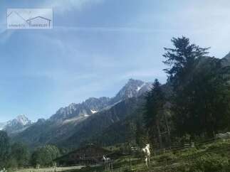 Discover a stunning property nestled amidst breathtaking mountain scenery.