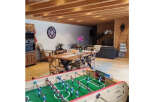 Discover this charming property featuring a spacious living area with exposed wooden beams and a cozy dining space.