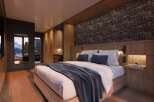 Luxurious mountain getaway: This stunning hotel room boasts a king-size bed, a spacious walk-in closet, and breathtaking views.