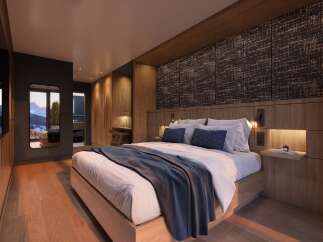 Luxurious mountain getaway: This stunning hotel room boasts a king-size bed, a spacious walk-in closet, and breathtaking views.