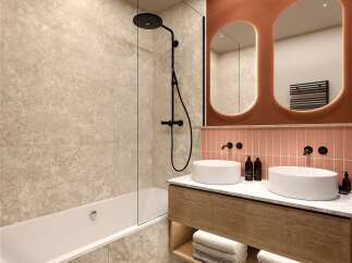 Modern bathroom with double sinks, a bathtub, and a walk-in shower.
