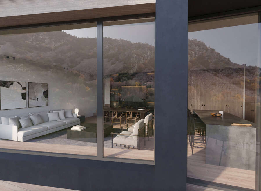 Mountain view home with floor to ceiling windows showcasing the open concept living space.
