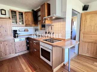 Discover a charming kitchen with wooden cabinetry and a cozy atmosphere.