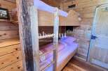 Cozy wooden bunk beds offer a rustic charm in this inviting space.