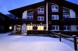 Discover a stunning chalet nestled in a winter wonderland.