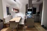Discover modern living in this stylish property! Featuring a sleek kitchen with contemporary appliances, perfect for culinary enthusiasts.