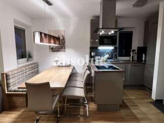 Discover modern living in this stylish property! Featuring a sleek kitchen with contemporary appliances, perfect for culinary enthusiasts.