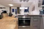 Discover modern living in this stylish property! Featuring a sleek kitchen with high-end appliances, perfect for culinary enthusiasts.