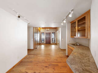 This stunning property boasts a spacious, open-concept floor plan with gleaming hardwood floors throughout.